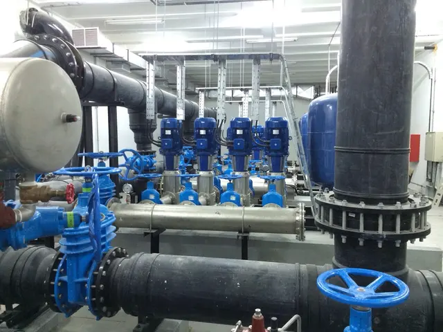 Plant-room booster pump set with HDPE headers and gate valves on a Kuwait project