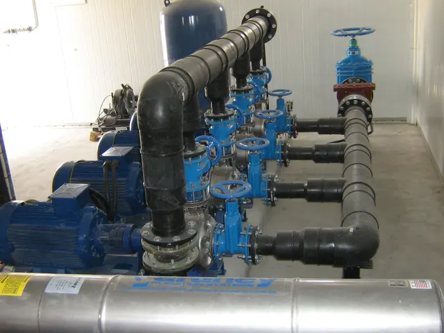 Plant-room HDPE manifold with horizontal pumps and gate valves on a Kuwait project