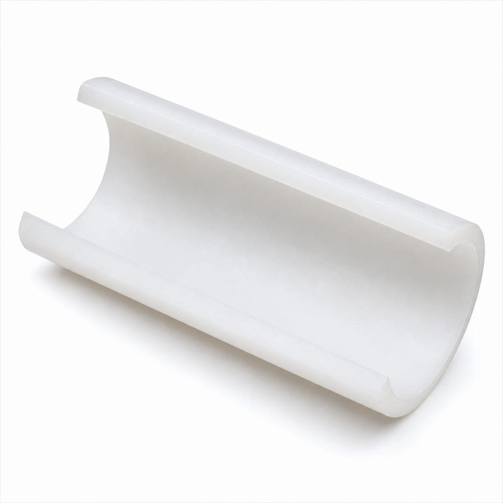 Macro view of a PE-Xa pipe cut open lengthwise, its inner wall smooth and clean with no pitting, scale, or discolouration